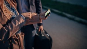 People using phone on the street