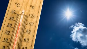 Hot summer day and a hundred fahrenheit on a thermometer.