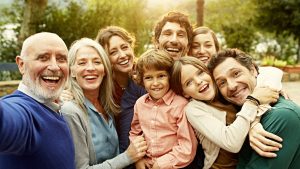 Cheerful multi-generation family at yard